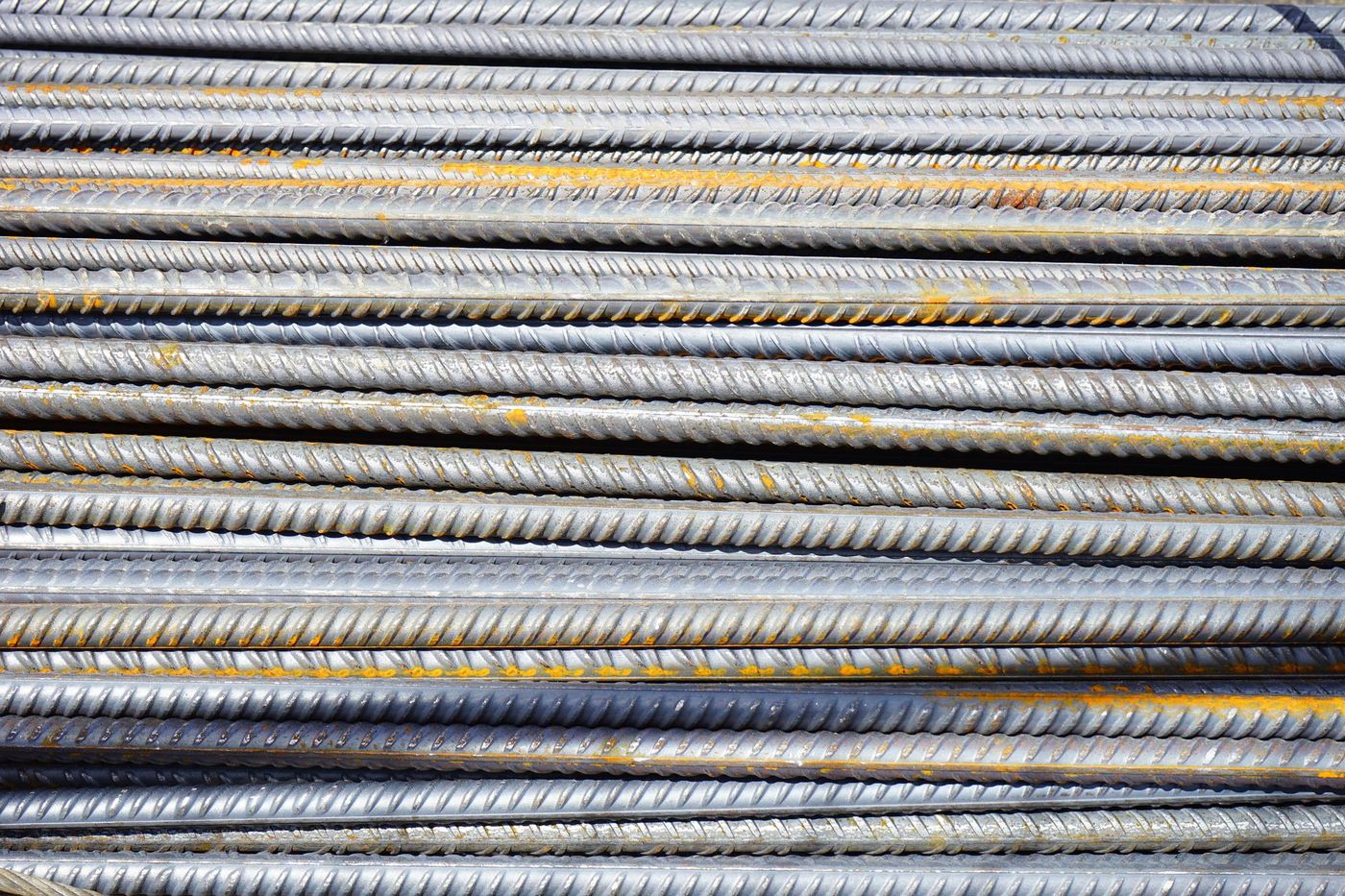 Steel reinforcing bar stacked and ready for casting, representative photo