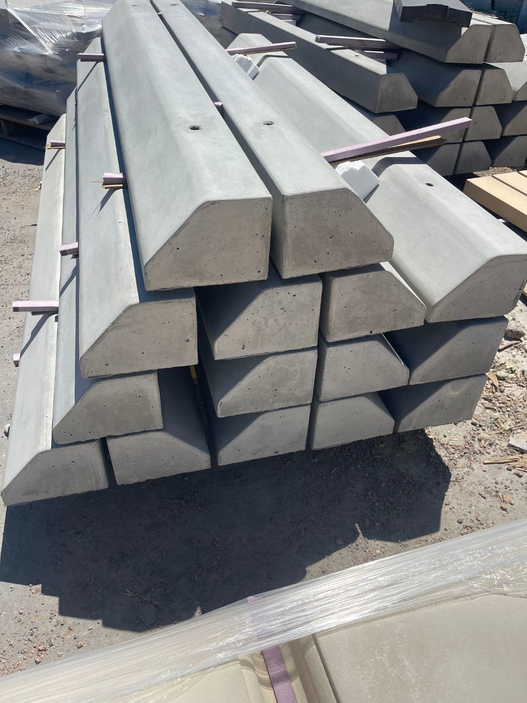 Stacked precast concrete curbs and castings in the Del Rio Concrete Precast yard